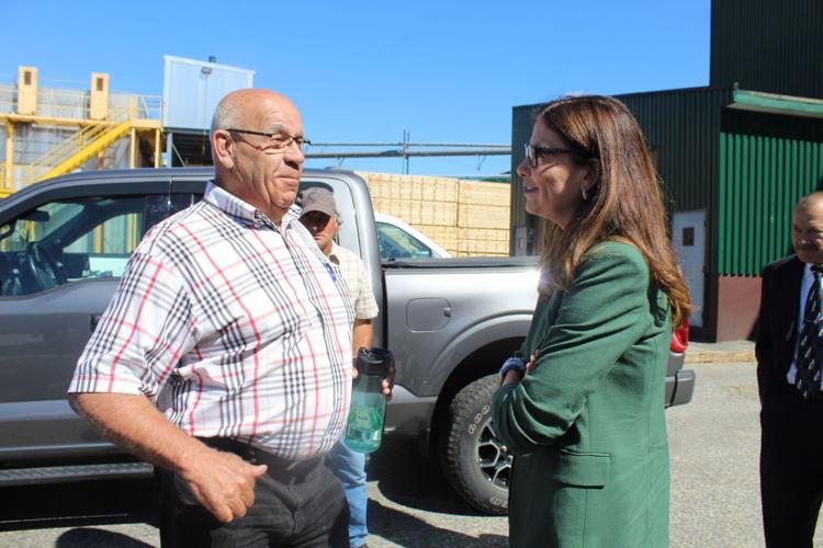 Milan Lumber Co. owner and president Richard Carrier speaks with Gov. Kelly Ayotte