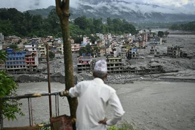 A rush of mud, rock and water inundated the town of Trishuli, Nepal, on Aug. 26, 2026, after a glacier collapsed.