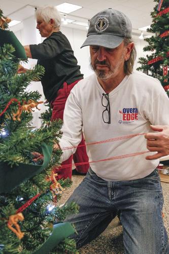 11-19-21 Fest Trees decorating vertical