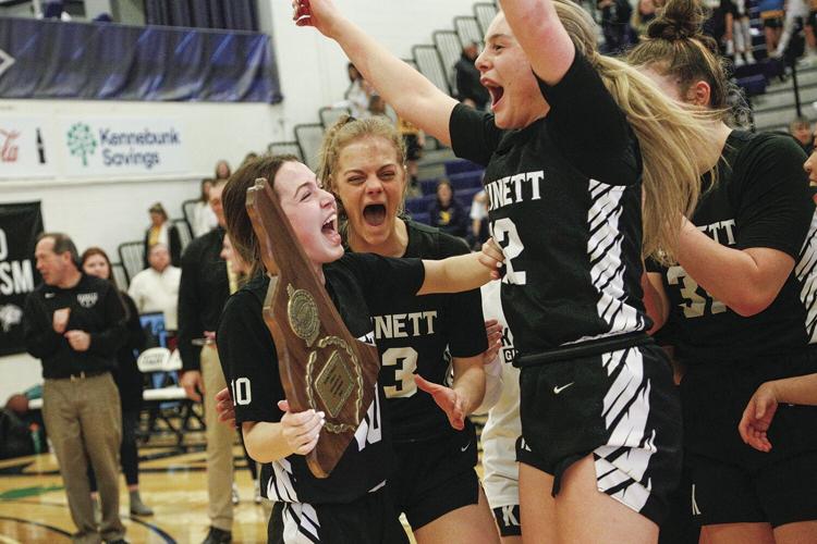 03-12-23 KHS WBB cheer with trophy tighter