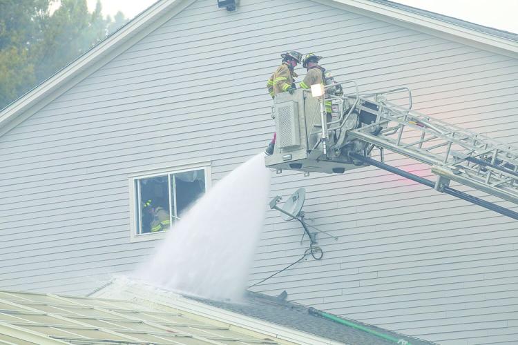 08-13-25 Holiday Inn-Brush Fire hosing by window
