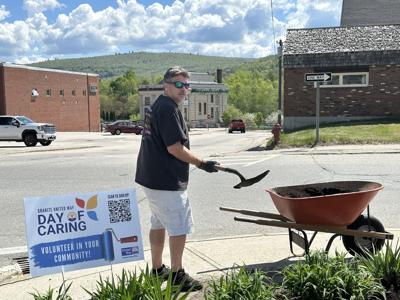 A volunteer helps out during the May 2025 Day of Caring. (LISA D. CONNELL FILE PHOTO)