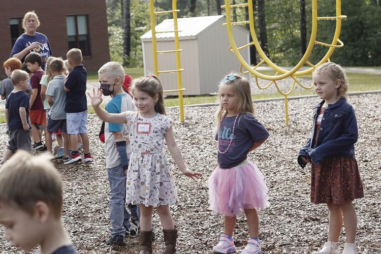08-31-22 Molly Ockett First Day waving on playground