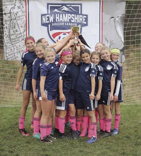 MWV Soccer Club wins state championship lifting trophy