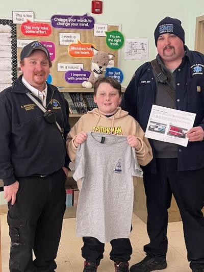 Sixth-grader Mason Guerin picks winning names of Milan & Dummer ambulances