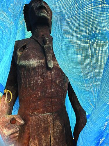 libby museum statue under tarp