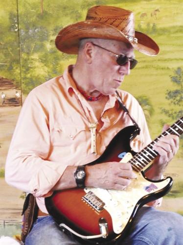 Snuffy Curtis playing guitar