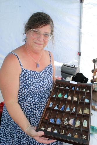 Lisa Thompson shows the objects she makes from sea glass