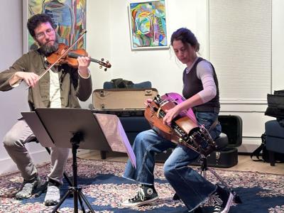 Shelby Trevor on violin and Noelle Beaudin on hurdy-gurdy perform a duo March 21