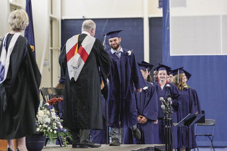 05-28-22 FA Graduation diploma shaking hands medium
