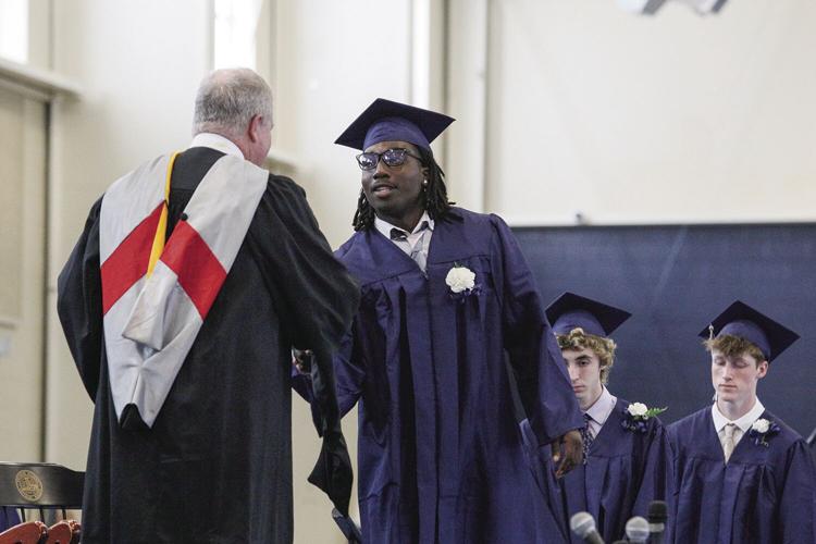 05-28-22 FA Graduation diploma shaking hands tighter