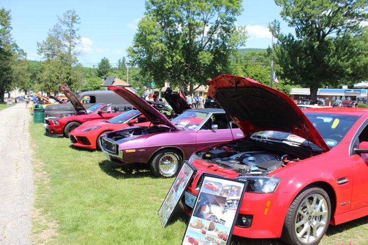 A row of classic cars adorns the Gorham Town Common