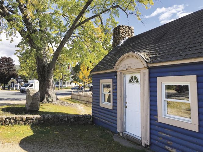 now razed blue cabin tom photo.jpg