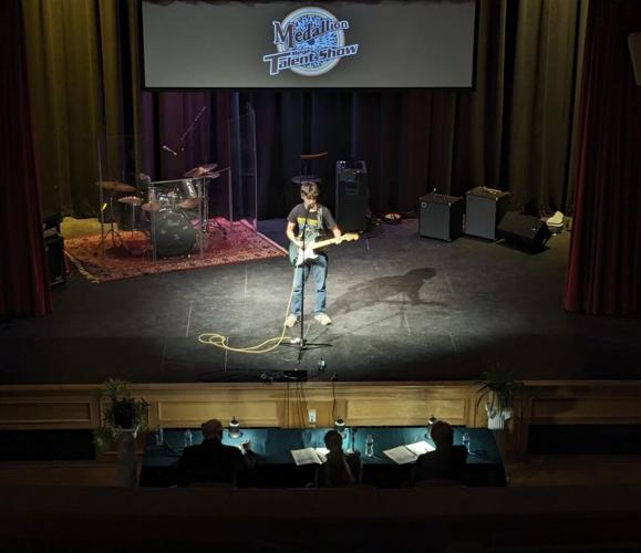 Evan Dube plays guitar