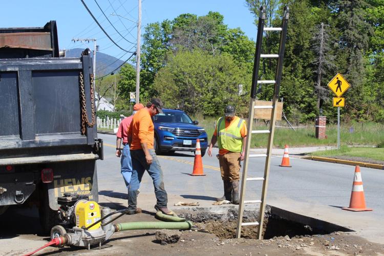 A Gorham Water & Sewer Department crew works on locating the source of a major water leak