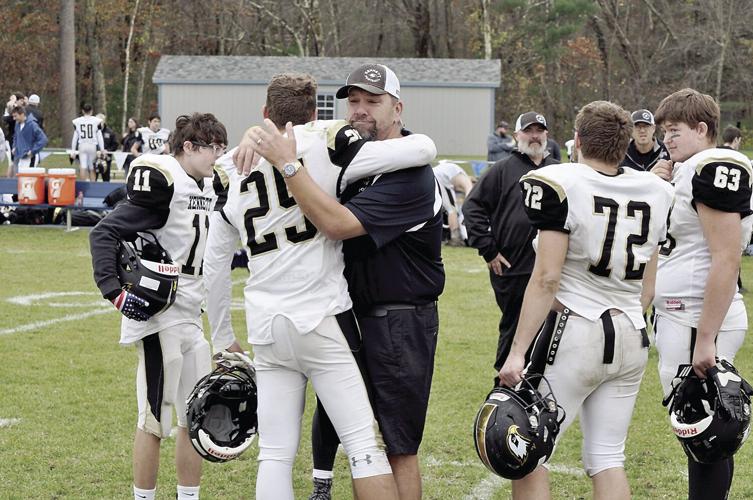 KHS Football - Coach Scott Stearns and Tavon Porter hug