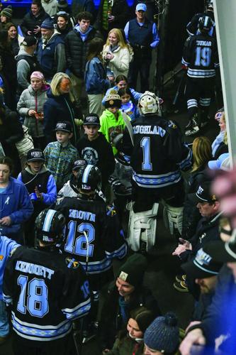 02-14-26 KHS Hockey Fights Cancer vertical high-fives
