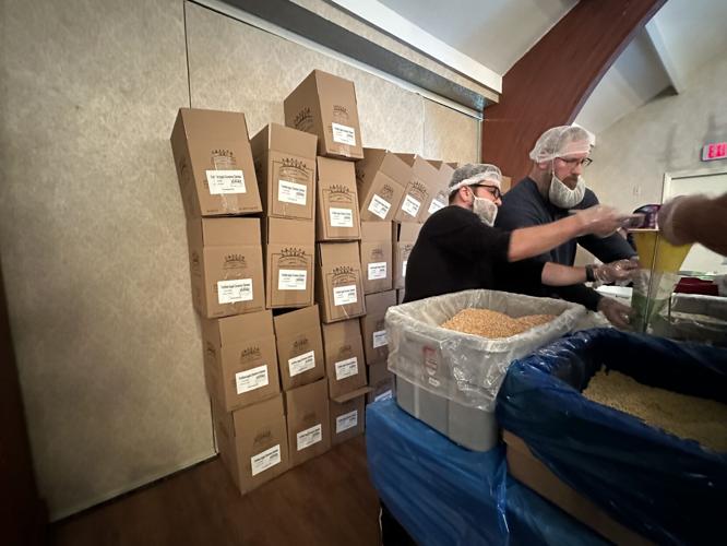 Lions International club members participate Oct. 25 in preparing breakfast meals