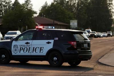 Police create evacuation corridors to quickly move vehicles out of a neighborhood threatened by a wildfire on Aug. 1, 2026.