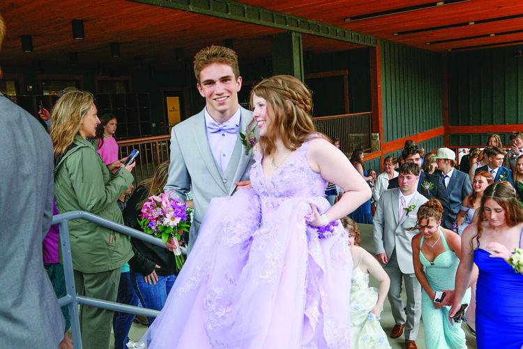 05-17-25 KHS Prom holding up dress medium