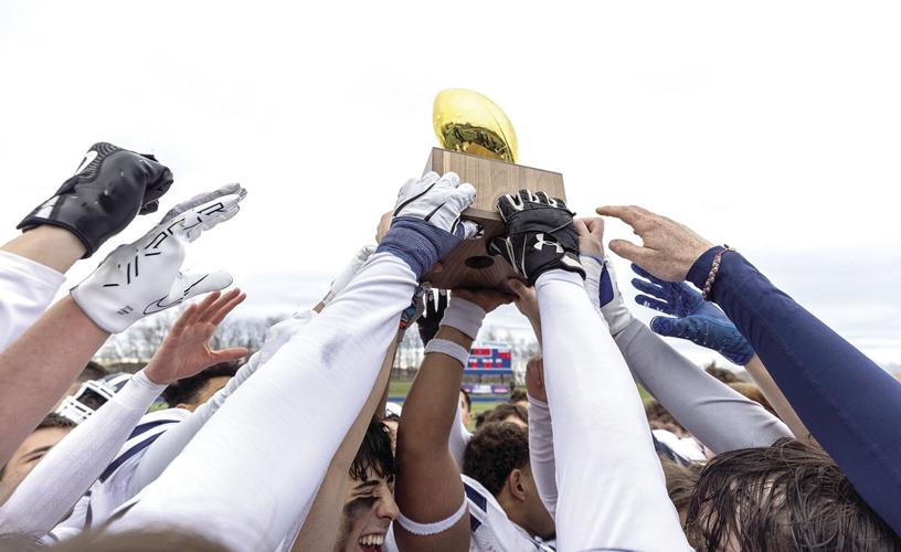 FA Football - state champs - raising the gold ball