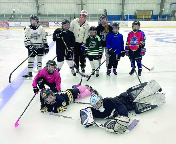 Kennett Hockey - camp - Grace Murphy with nine girls