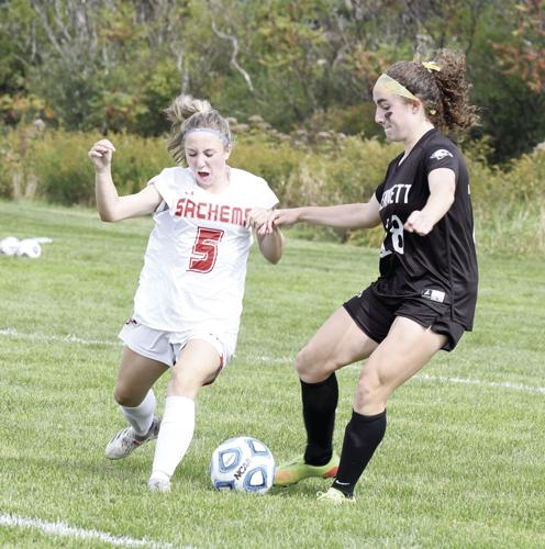 KHS Girls Soccer - Lydia Wiggin beats a Laconia defender