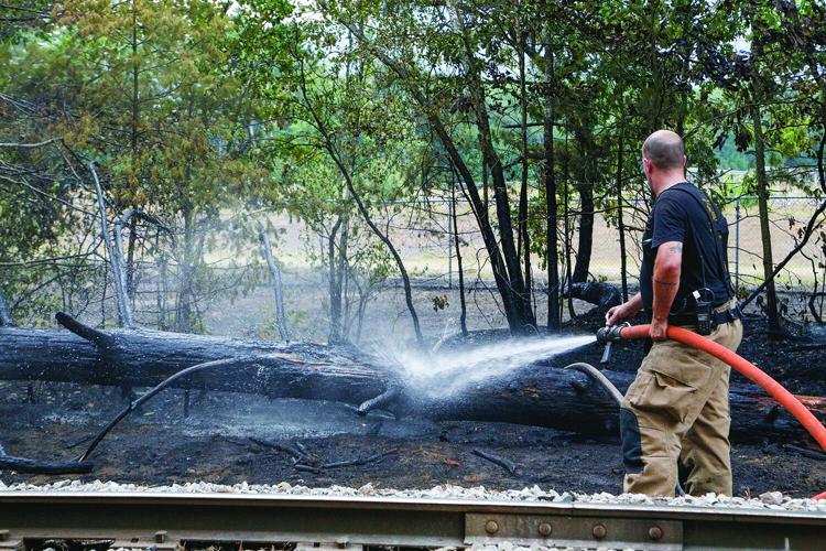 08-13-25 Holiday Inn-Brush Fire brush hosing behind 1