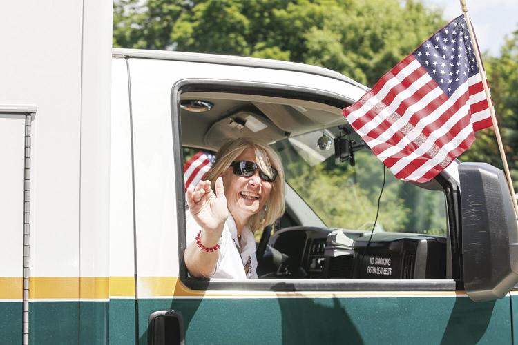 07-04-22 4th Bartlett Parade smiling out window ems
