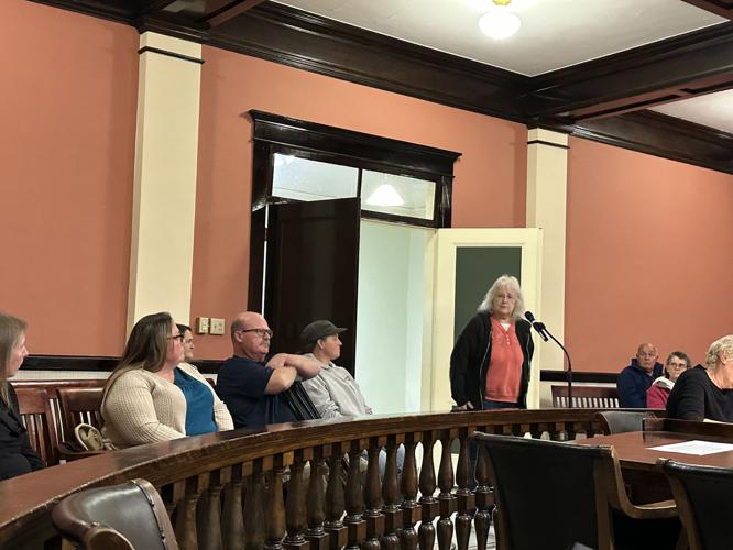 Amy Welch (left in blue) and Irene Blais (standing right)