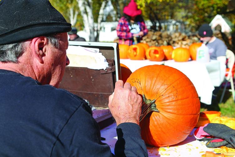 10-18-25 Jackson Pumpkin Carving sketching behind