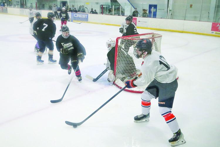 11-29-25 Kennett Hockey Alum carrying behind net