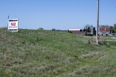 A sign in a small town in Kansas opposes a proposal for a data center nearby.