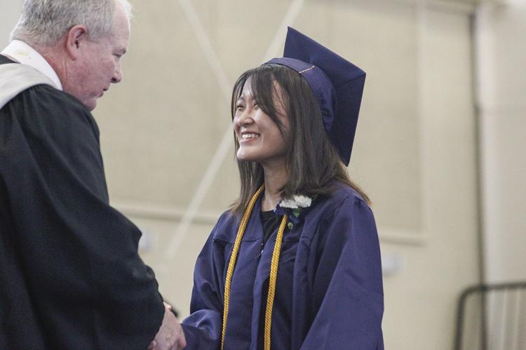 05-28-22 FA Graduation shaking hands tight