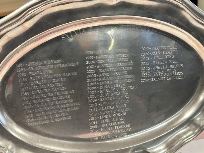 The names of Sylvia Evans Award winners are engraved on this platter