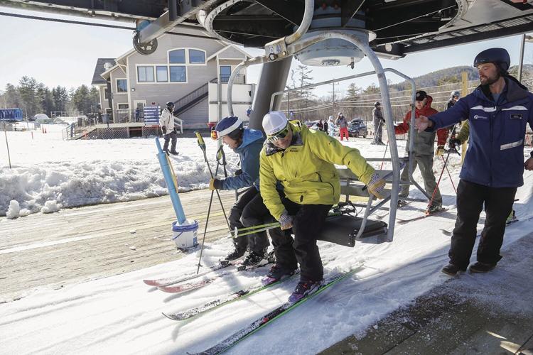 04-02-23 Attitash Triple getting on lift