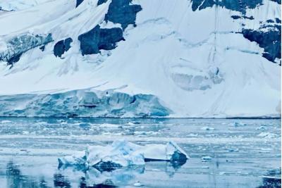A glacier front meets the sea in Antarctica. The ice sheet holds enough water to raise global sea level by about 190 feet (58 meters). Qiyue Sun