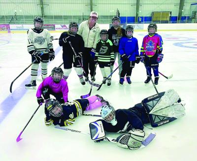 Kennett Hockey - camp - Grace Murphy with nine girls
