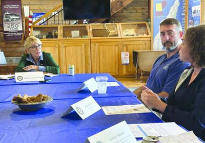 In Lancaster on Aug. 20, U.S. Sen. Maggie Hassan, D-NH (left) hears from Town Manager Jessica Cy
