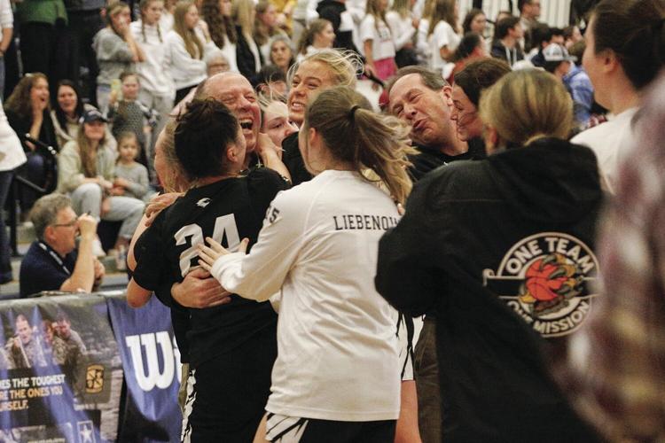 03-12-23 KHS WBB hug after win tightest