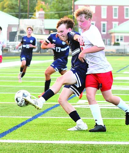 FA Boys Soccer - Jacob Eveleth shields the ball