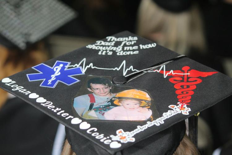 A graduate wears his heart on his mortarboard with a message to his family