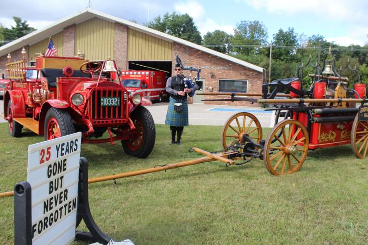 Sean McMeeken plays the bagpipes outside the Gorham Fire Department on the 25th anniversary of 9/11