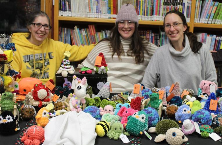 Laurel Sabourin, Joan Riendeau and Sarah Mafera display homemade crafts