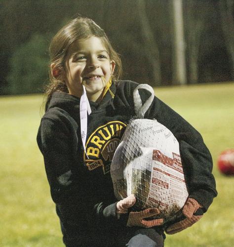 11-22-24 Conway Rec Turkey Trot hoisting turkey smile