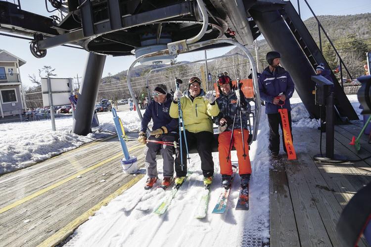 04-02-23 Attitash Triple last chair getting on