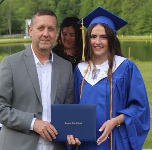 GRS school board member Dennis Wade and graduate Lily Gorban, Gina Saladino in background