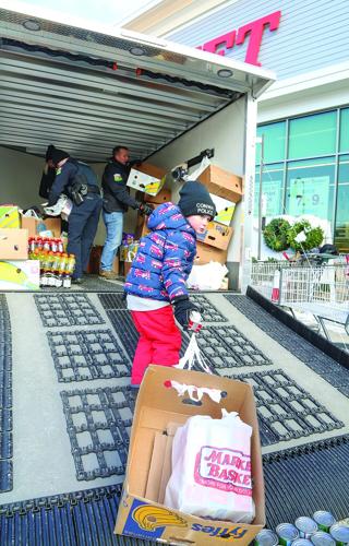 12-06-25 Conway PD Food Drive pulling up vertical