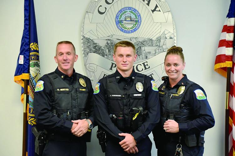 Conway patrolman Jack Robinson with Chief Mattei and Lt. Kelley-Scott