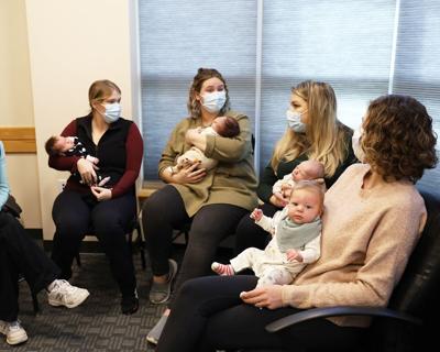 A group of moms gather with their newborns at the New Moms Support Group at Memorial Hospital.